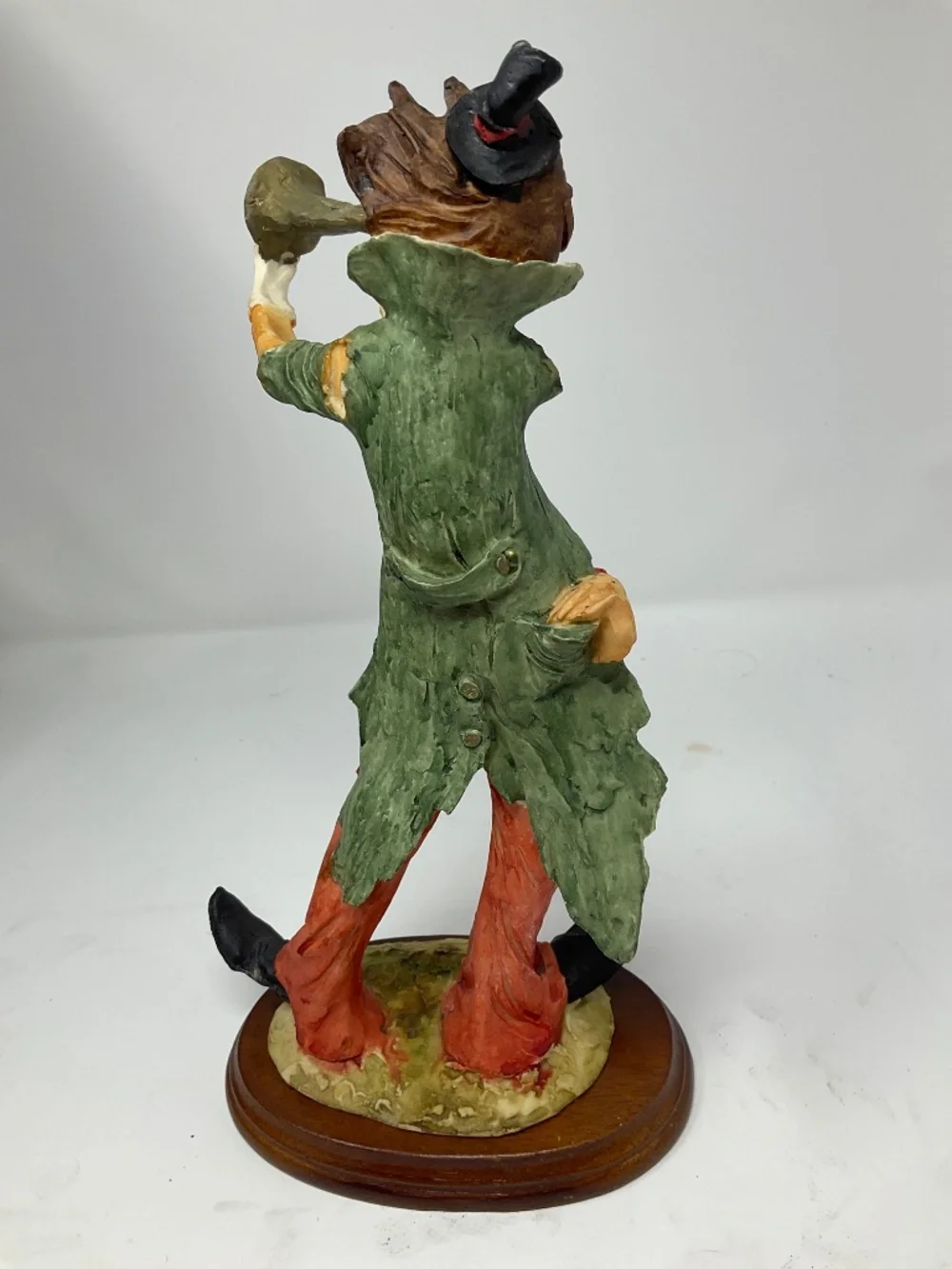 Vintage hobo clown paying trumpet. H289